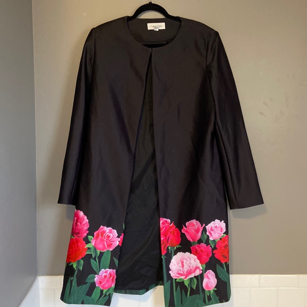 Calvin Klein, long-sleeved, long lined jacket.  Black with red and pink roses